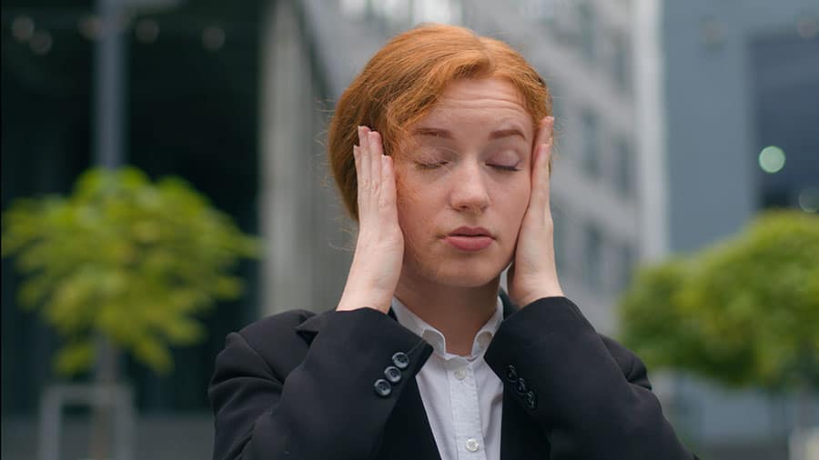 Close up unhappy tired young Caucasian ginger woman Gen Z with tax problems